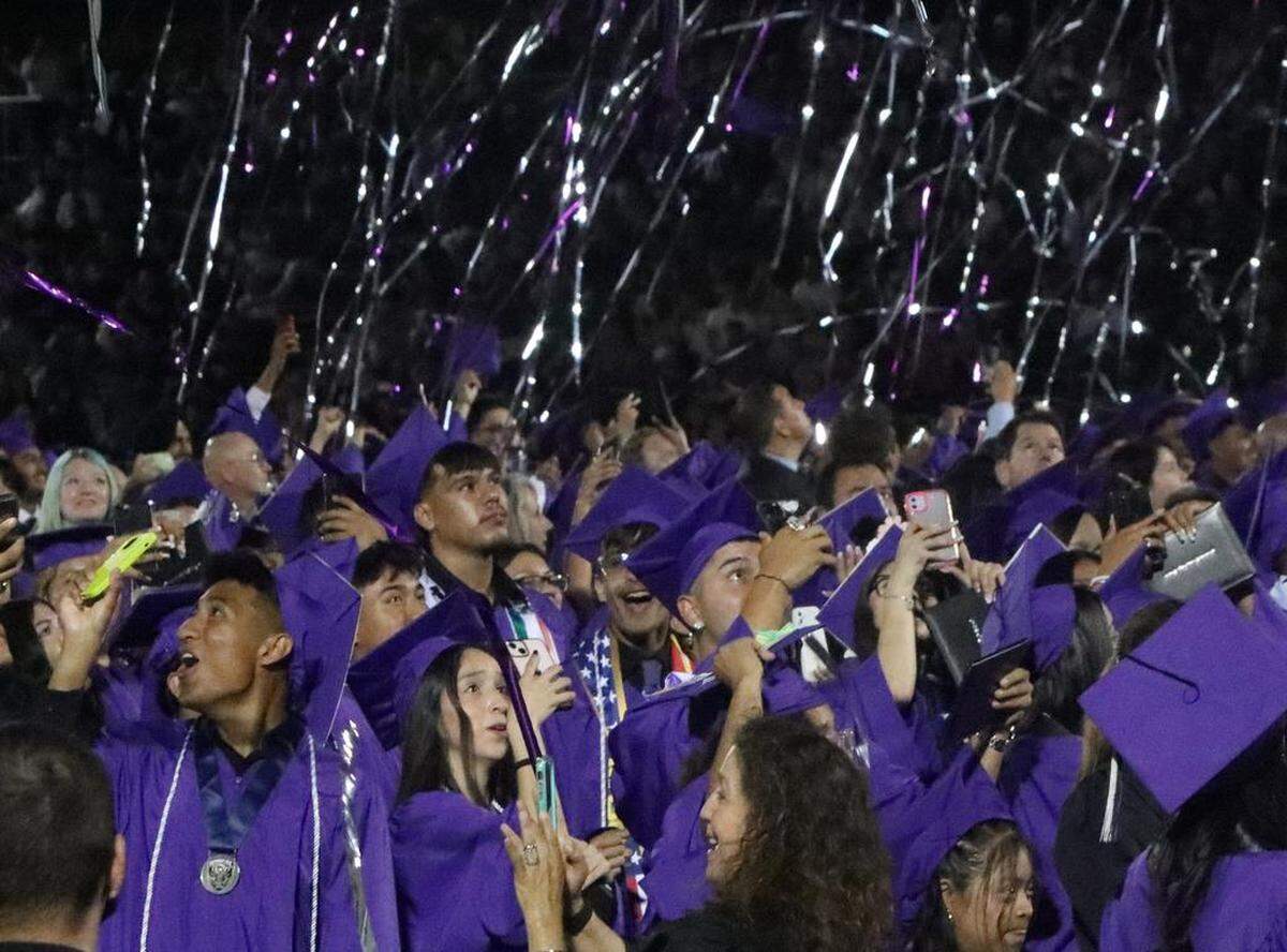Streamers rain down on Madera South High graduates during the graduation ceremony at Madera Memorial Stadium on June 7, 2023.