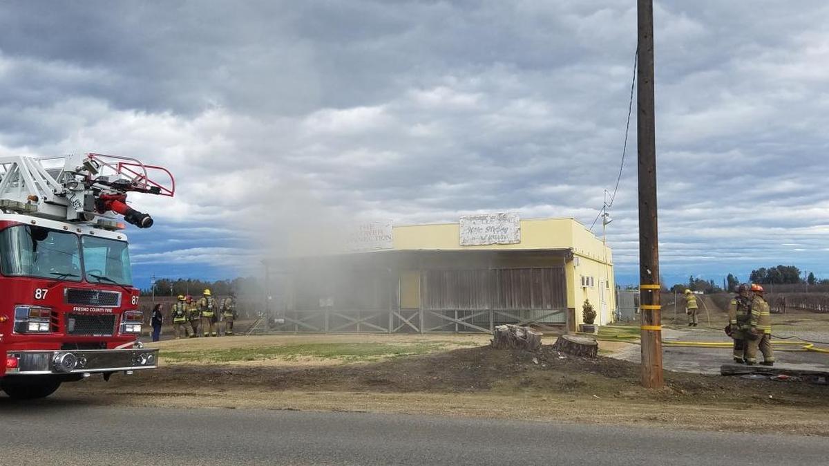 Smoke pours out of the Flower Connection shop in Easton Sunday, the aftermath of a small fire at the business.