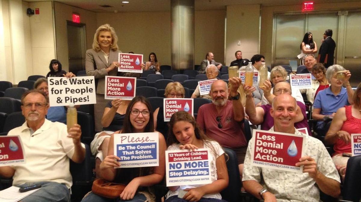 Northeast Fresno residents brought signs and dirty water to the City Council meeting Thursday to draw attention to their water problems. The council listened to a speech from Holly Carter, experts from the Board of Public Health and stories from citizens.