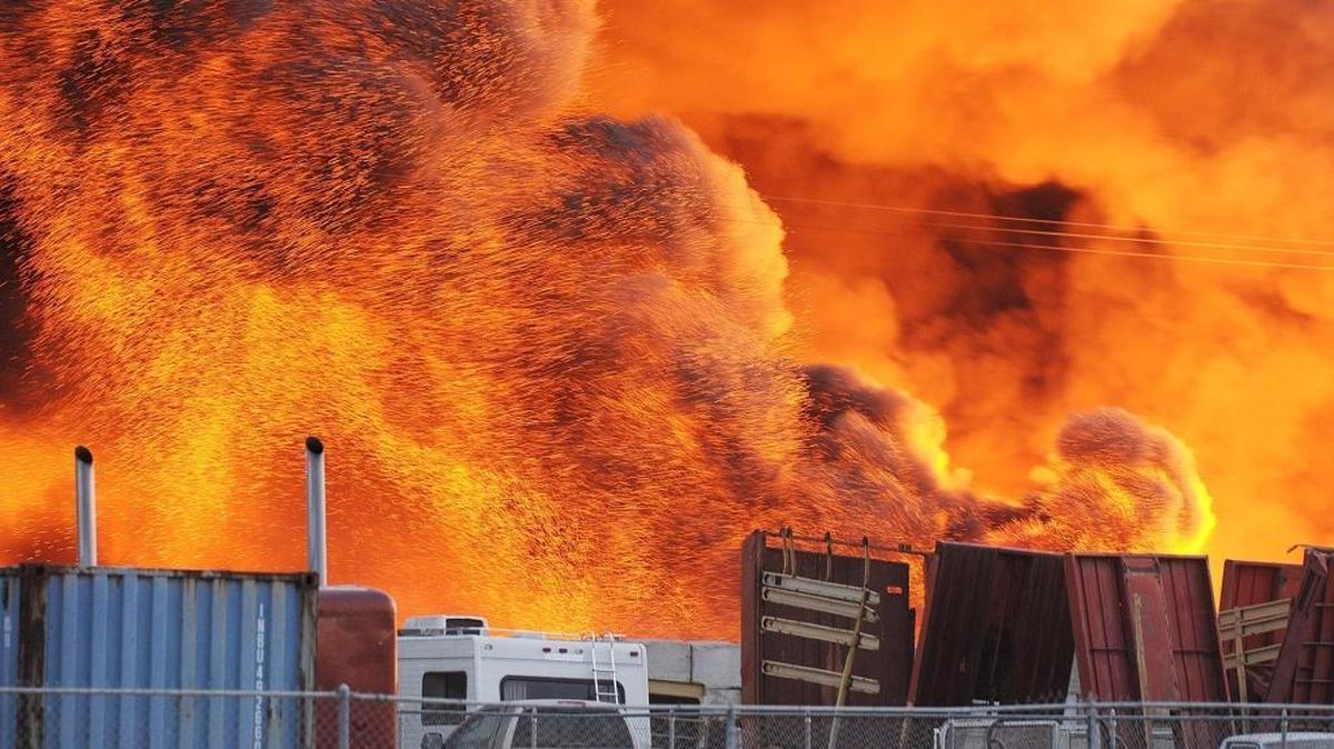 
A large fire burns Tuesday, Oct. 13, 2015 at Pacific Coast Recycling in Dos Palos.

