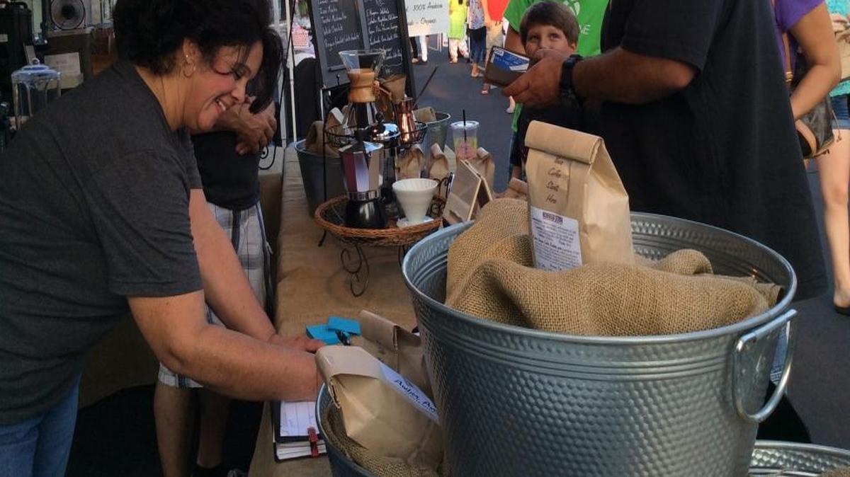 
Rick and Yoli Reeves serve customers at the Friday evening Old Town Clovis Farmers Market. This is Amber Avenue's second summer at the farmers market.
