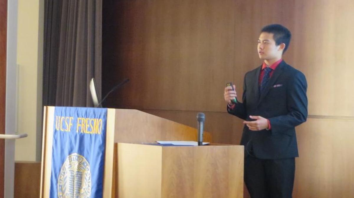 Simon Cao from Clovis North High School presents his research project titled “Safety Evaluation of Endoscopic Interventions in Patients with Thrombocytopenia and Coagulopathy” at a culmination ceremony in UCSF’s downtown Fresno auditorium.
