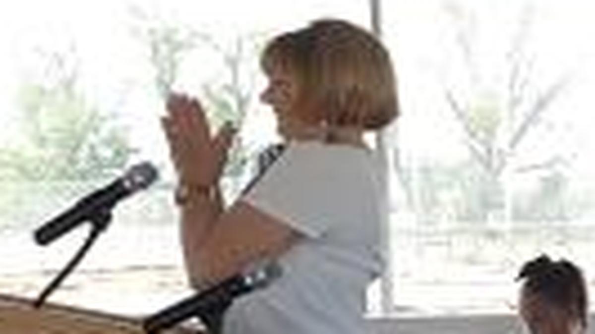 Virginia “Ginny” Boris, the new school’s namesake, reacts to the crowd during a ceremonial groundbreaking on March 18.