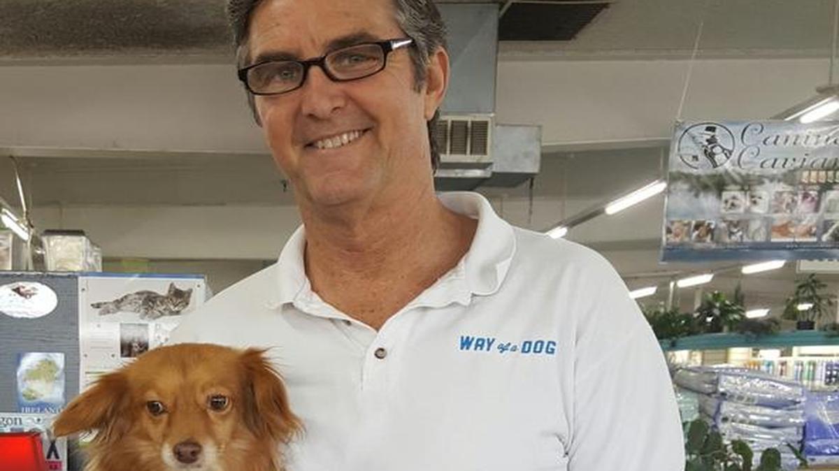 Joe Ozier, owner of Way of a Dog, holds Jimmy.