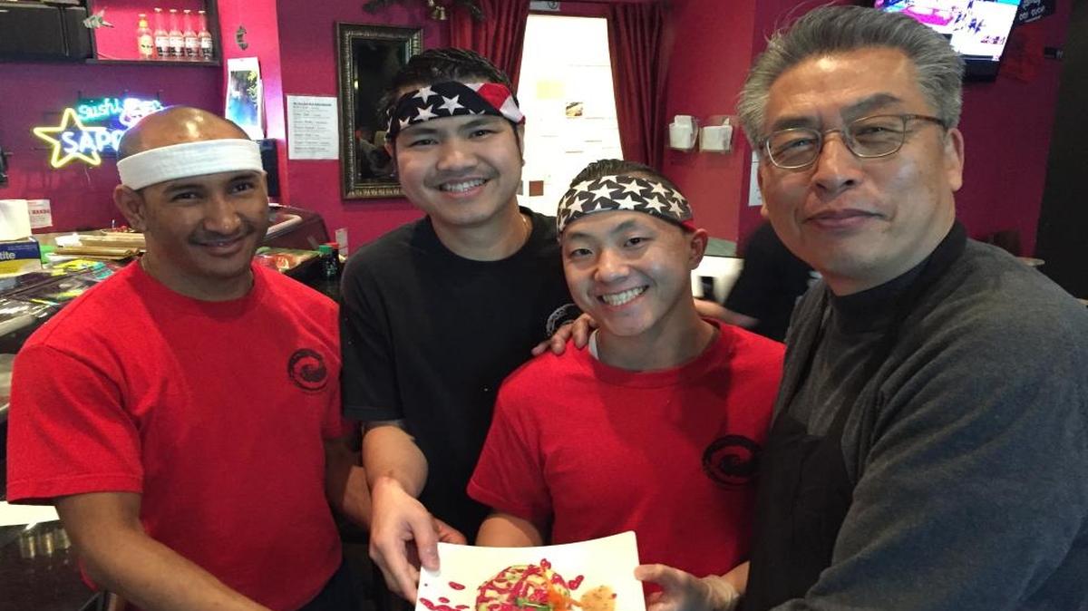 Chris Chon (right) displays one of his restaurant’s special sushi rolls — the Green Ball. It is made with crabmeat, tuna, salmon, avocado and beet sauce. Chon is pictured with his sushi chefs, from left, Somkhuan “Tou” Kunpanich, Cuong “Donny” T. Pham and Pao Xiong.