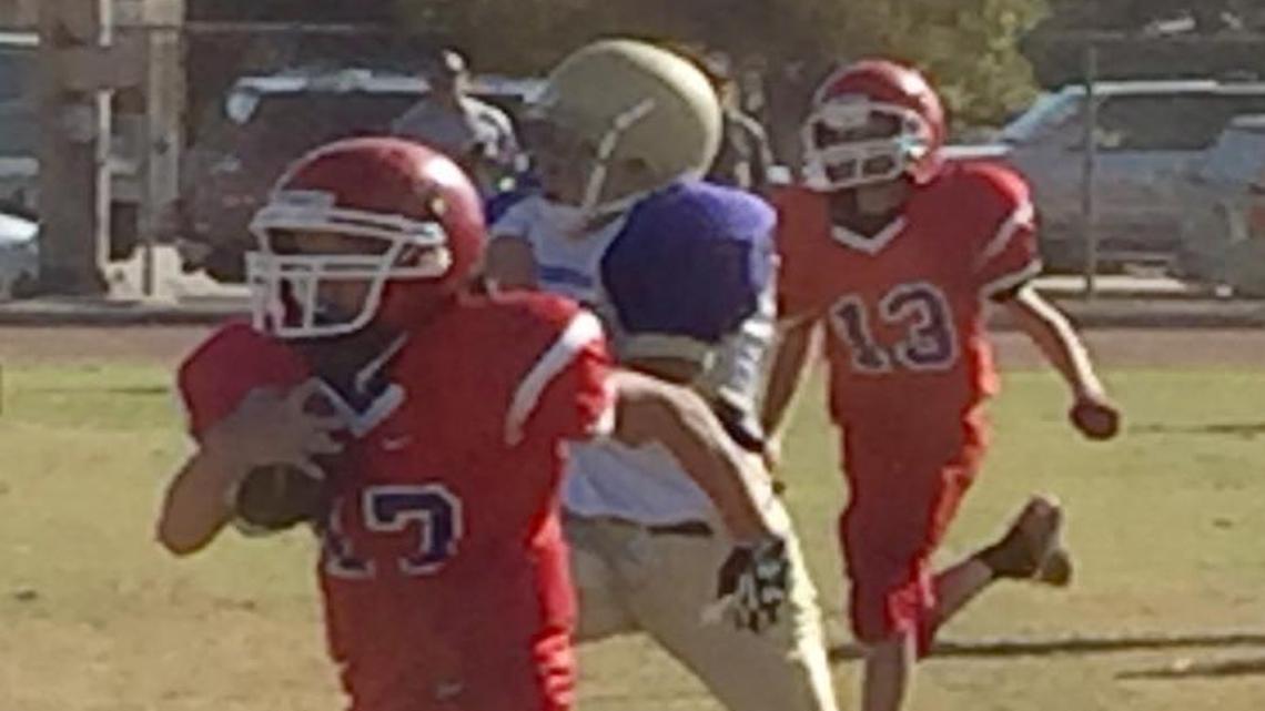 A seventh-grade player for Alta Sierra runs for extra yardage against Clark.