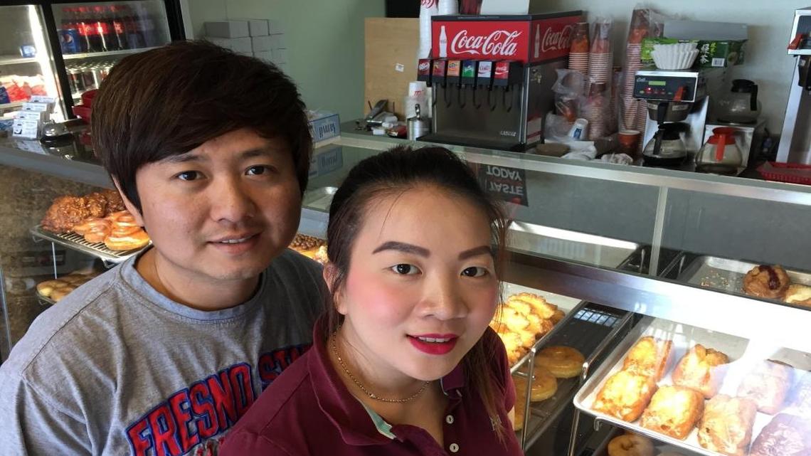 Thai Touch, left, and his wife, Amy Sok, run Judy’s Donuts at Willow and Nees avenues in Clovis.