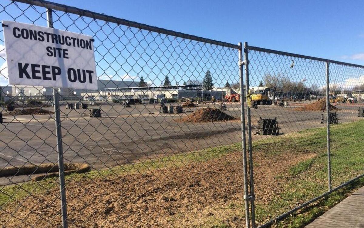Construction on a solar panel system in the Buchanan High School parking lot is underway.