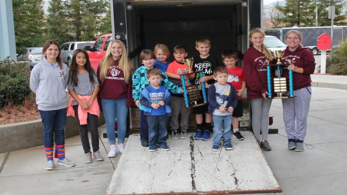 Students from Mickey Cox Elementary delivered more than 3,000 donated food items to Ronald McDonald House last week. From left to right are Payton Hiester, Maya Athayasay, Megan Haubelt, Cameron Hall, Connor Dillon, James Dillon, Maxx Ruiz, Dylan Hall, Mason Hall, Connor Hall, Khloe Beckman and Samantha Haubelt.