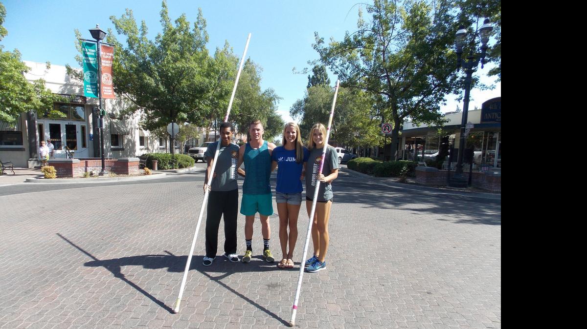 Nicklaus Wilcot, Brad Beekman, Mallory Gilbert and Shelby Noble stand Pollasky Avenue in Old Town Clovis, where the North American Pole Vault Championship will be held at 5 p.m. Friday, July 24 during the farmers market.