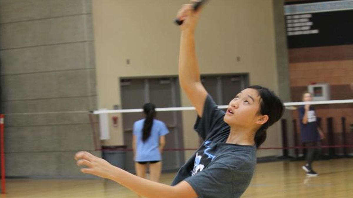 Kimberly Liu goes up for a shot during a badminton practice at Clovis North High School.
