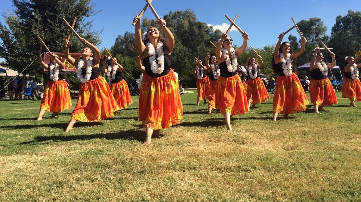 Dancers use split bamboo as part of their performance at Aloha in the Park in October 2016.