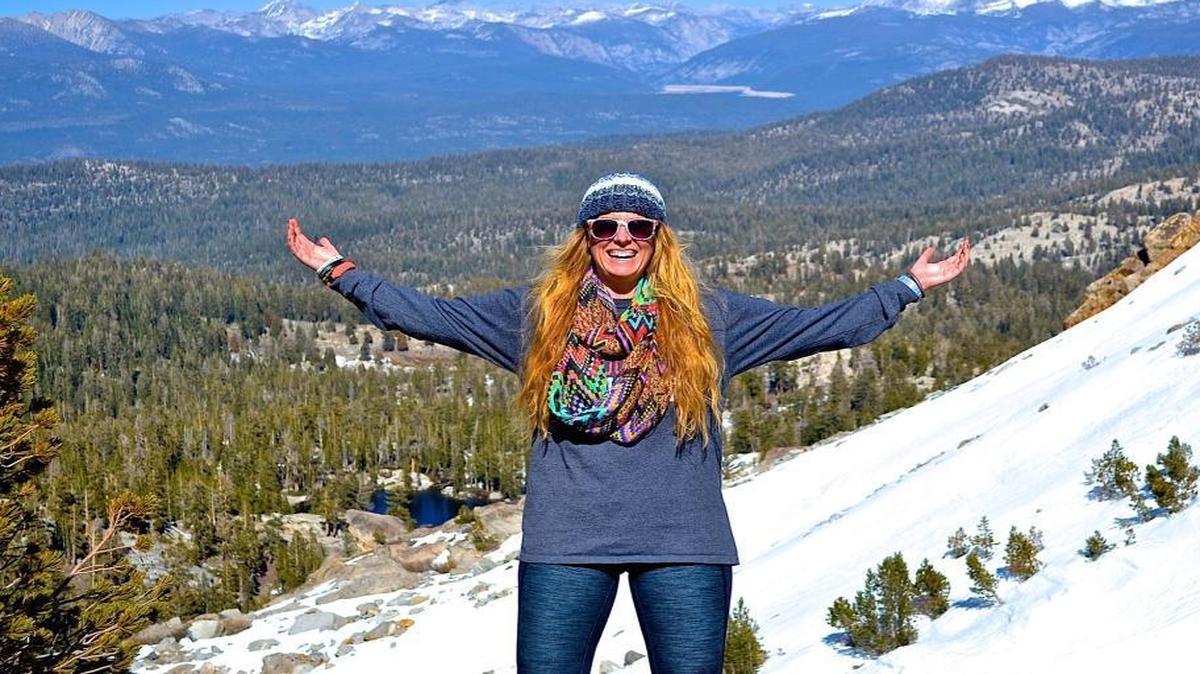 Sierra Mapping Project founder Sara Fry, standing on Kaiser Ridge, leads a hike using San Joaquin River Trail guidebooks on April 4.