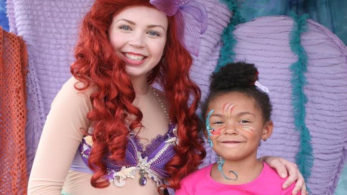 Sydney Brueckner and Dottie Essien pose as Buchanan High promotes its next performance, “The Little Mermaid.”