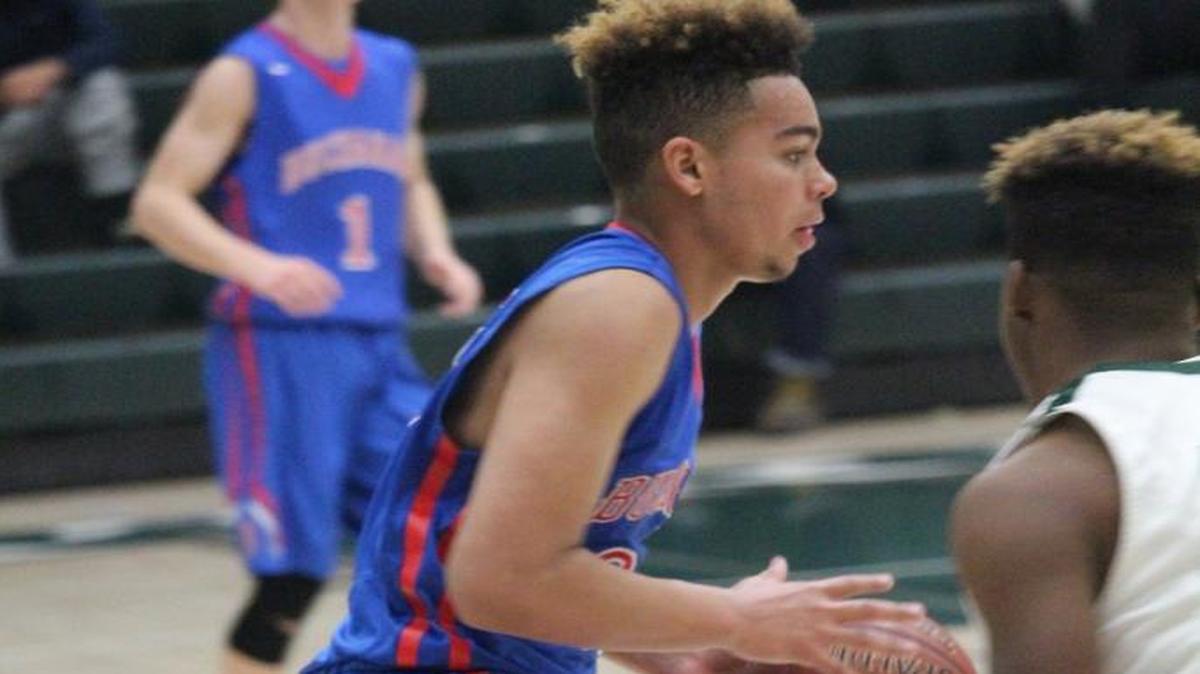 Tyree Leggett, leading scorer for the Buchanan High School basketball team, drives to the basket in a game against Hoover High School of Fresno, Buchanan won 70-54.