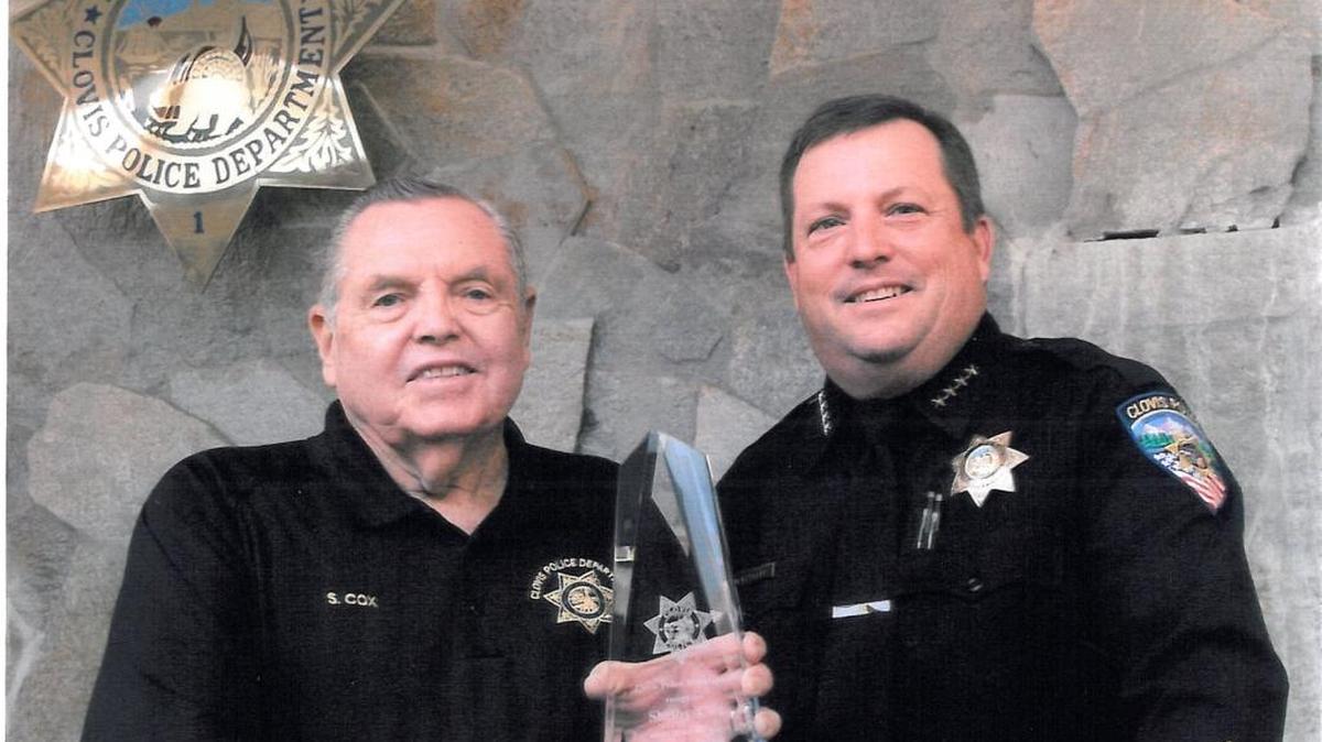 
Clovis Police Chief Matt Basgall presents Shelby Cox with the 2013 Police Officer of the Year award. 
