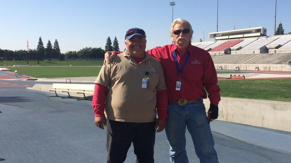 Don Martens, special events team leader for Buchanan Education Center, and his “right hand man” Reynaldo Nunez, left, work to ensure that Veterans Memorial Stadium is ready for the CIF state championship track meet and this week’s graduation ceremonies.