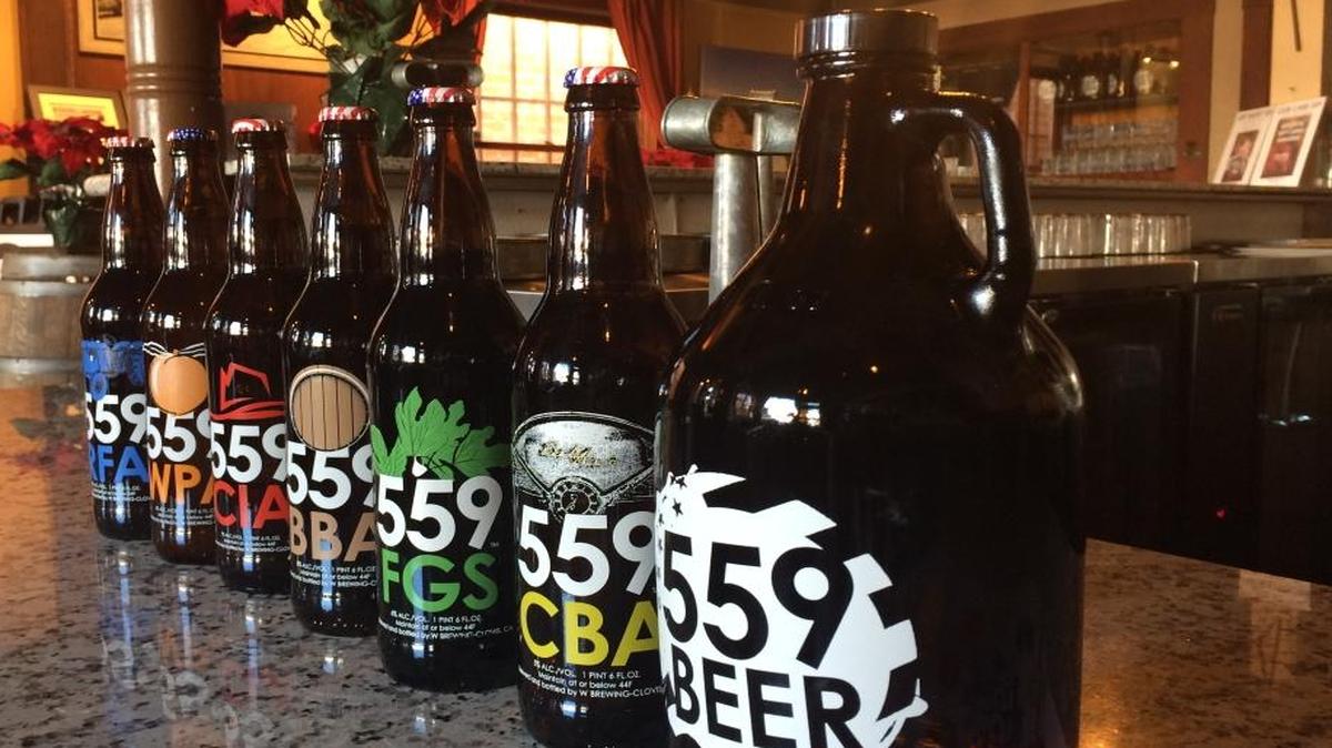 559 Local offers six bottled beers, but any of the eight beers on tap can be poured into a 64-ounce growler, at right.
