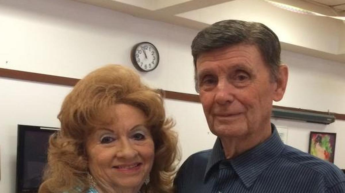 Betty Piland and Ken Cowan dance to live music.