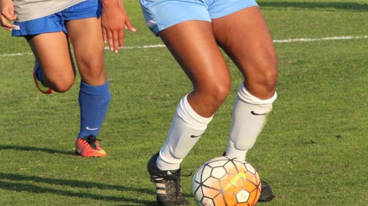 Sierra Alvarez advances the ball for Clovis North High School in a game against Madera High School.