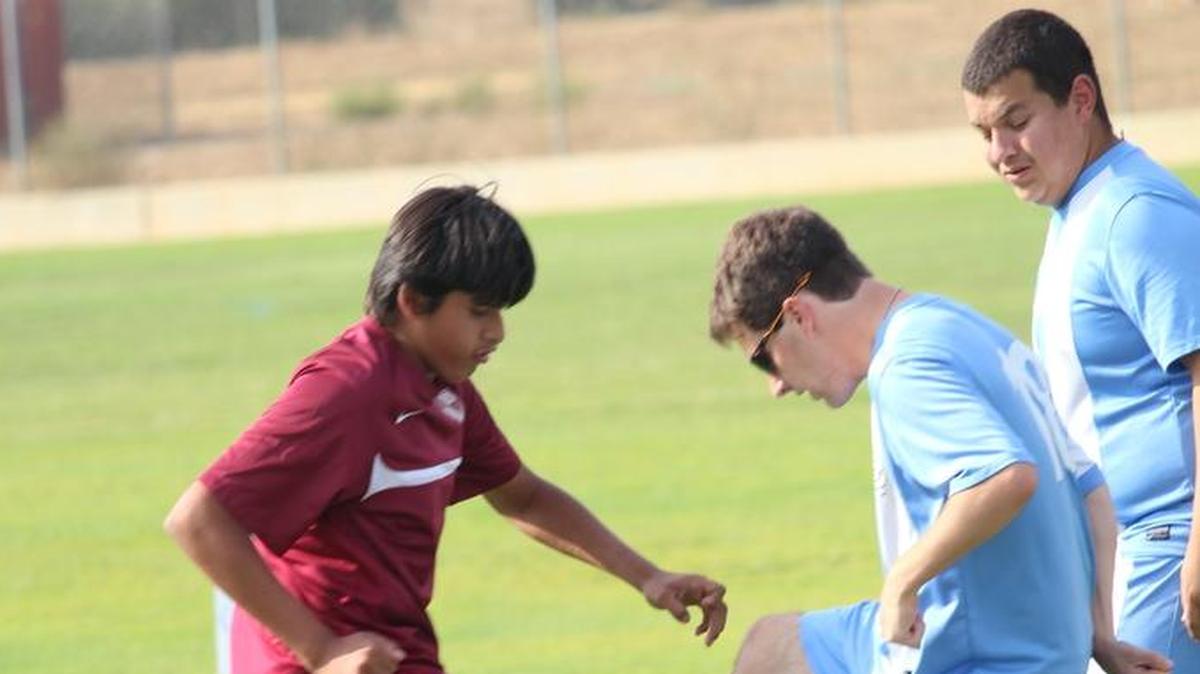 Clovis West’s Eric Cabanillas goes up against Clovis North’s Matthew Taffera.