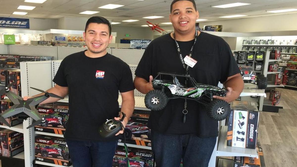 Hobby People team members Felipe Ortiz, left, and Richard Huggins display some of the store’s remote controlled items.