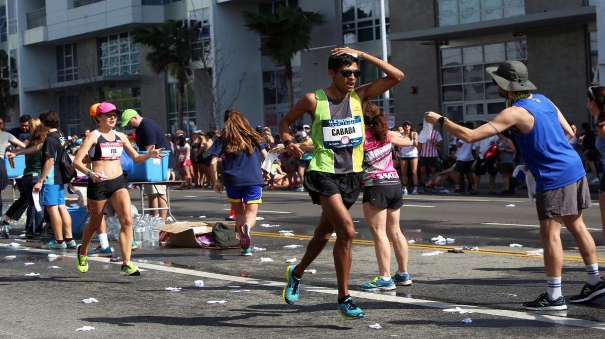 Buchanan High School graduate Fernando Cabada struggled at the 2016 U.S. Olympic Men’s Marathon Trials and finished 55th in 2:27:53, almost 17 minutes behind the winning time. Four years ago he finished seventh with a time about 16 minutes faster. Here, Cabada passes a water aid station with about 6 miles to go in the 26.2-mile race.