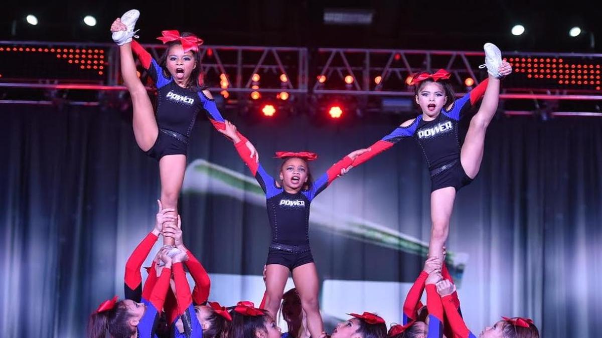 Power Fresno Lady Prada, an 11-and-under team, performs a routine in Dallas, Texas. The team is one of three Power Cheer competition teams planning to attend The Summit, a major cheerleading competition in Orlando, Florida.