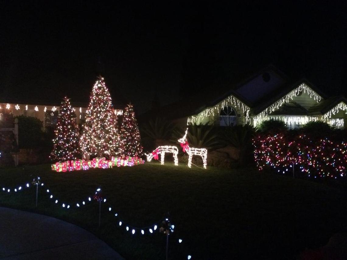 Reindeer stand on this home’s lawn in the Candy Cane Lane neighborhood in Clovis.