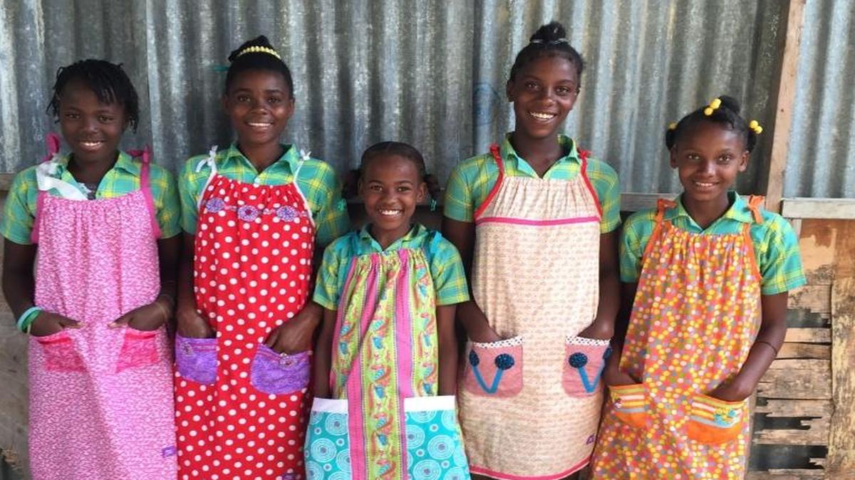 Local volunteers with Dress a Girl Around the World delivered handmade dresses to girls in Haiti in 2015.