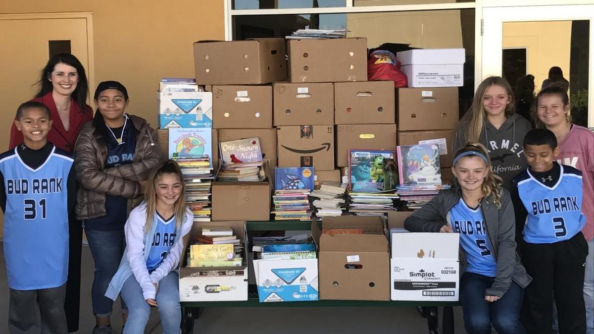 Bud Rank Elementary students presented 2,318 books to Marjaree Mason Executive Director Nicole Linder. From left are Sean Amajor, Linder, Ella Jackson, Katie Morris, ASB President Brooke Sherrell, Reagan Larson, Trey Jackson and Cambria Cook.