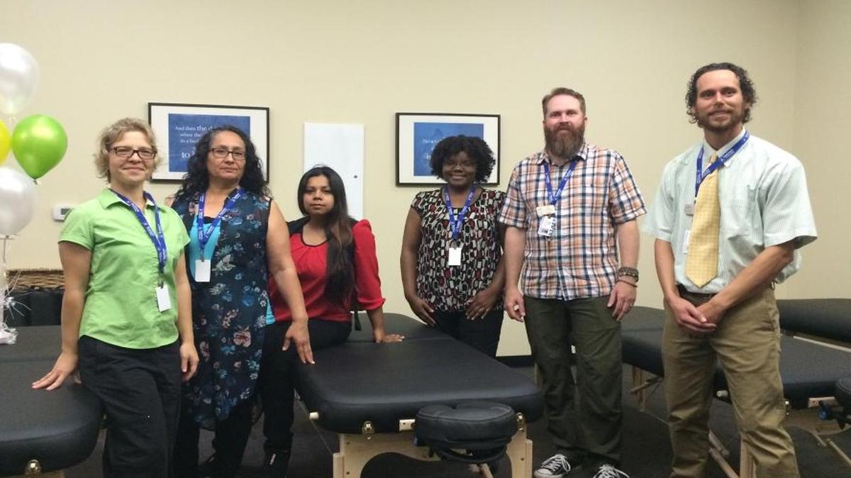 From left are National Holistic Institute massage therapy students Jamie Nemecek, Ramona Chavez, Alma Velasquez and Soynia Cosby along with mentor Dano O’Connor and program manager Michael Greene.