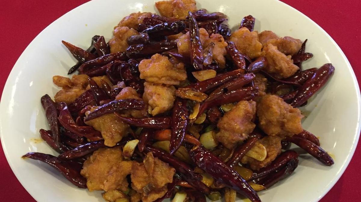 Chongqing Style Chicken is seasoned with chili pepper. It looks spicier than it is, says Jim Chi, manager of Hunan Chinese Restaurant.