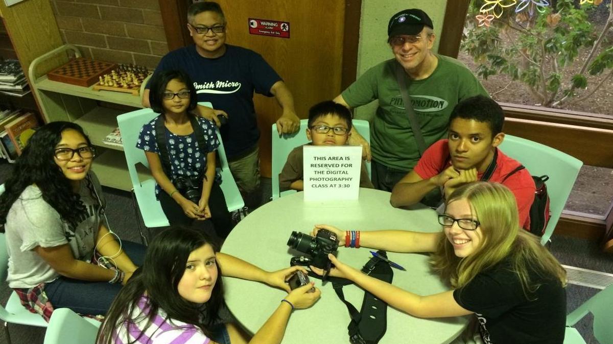 
The Clovis Regional Library’s digital photography class, clockwise from far left, are Sarah Saporna, Rowena Romero, Brian Romero, Christian Romero, instructor Marc Blake, Kayland Harrison, Emily Ladd, and Sami Schramm. 
