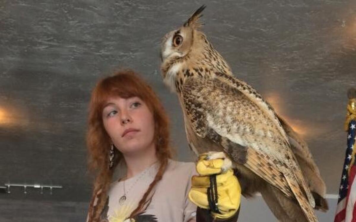 Fresno Wildlife Rehabilitation Service volunteer Jaime Carlino holds Kohgee, a Eurasian eagle owl who was smuggled into California as an egg in 2005.