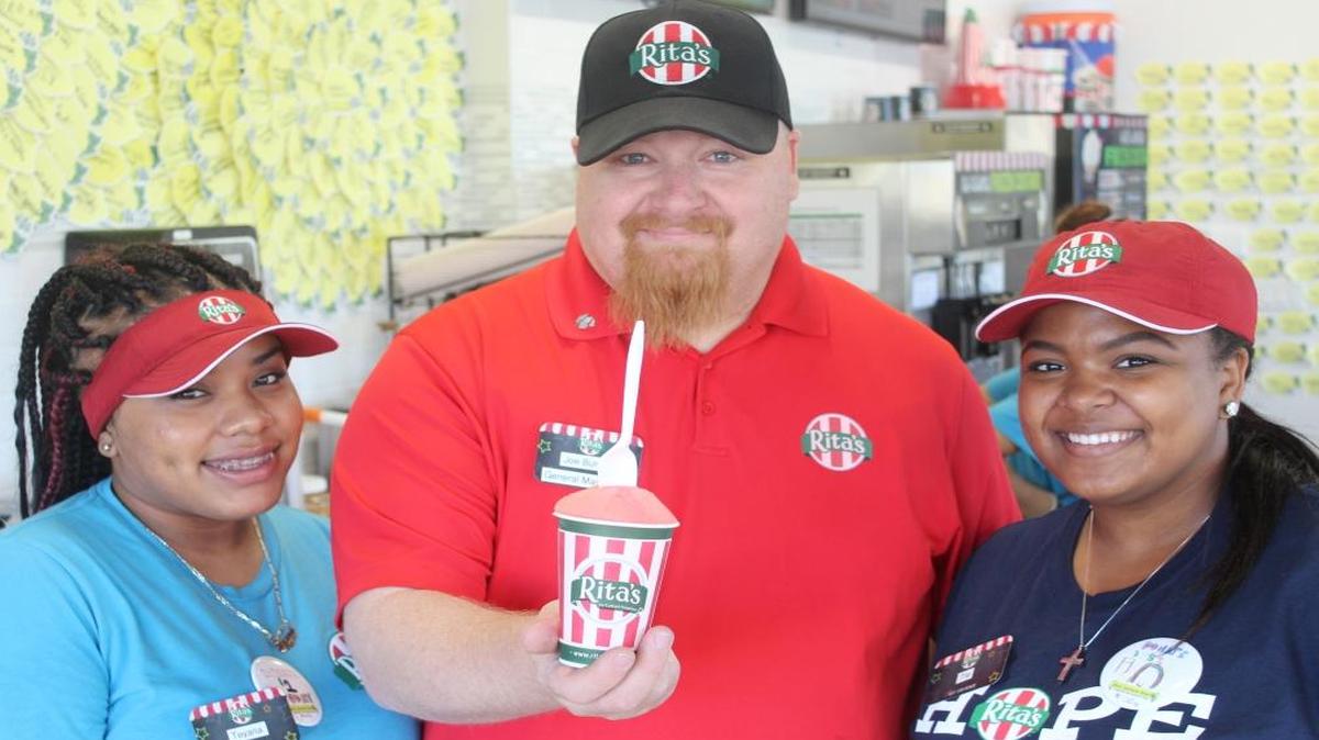 Rita’s Italian Ice opened in June on Shaw Avenue in the Sierra Pavilions Shopping Center. General Manager Joe Burrus holds an Italian Ice. He is pictured with employees Teyana Ward (left) and Tia Lewis.