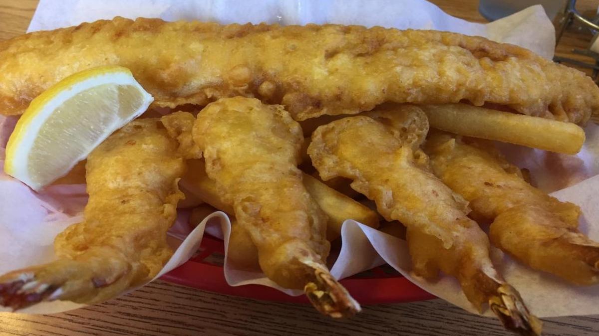 West Coast Fish N’ Chips offers several combo plates. This one features one piece of fish and four prawns.