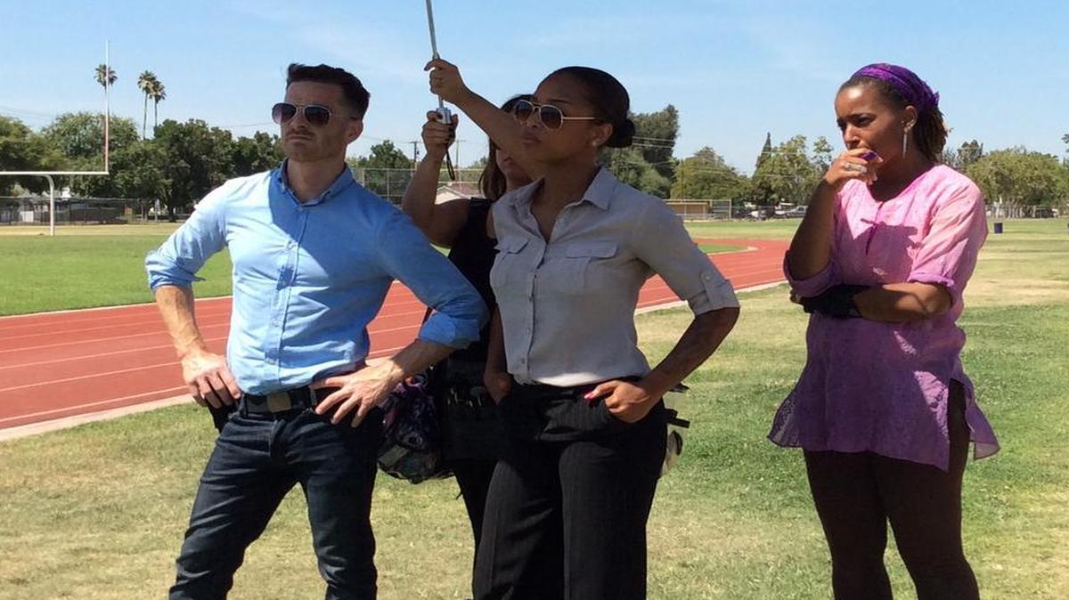 
Director Nia Malika Dixon, right, helps actors Chris Damon and Brittany S. Hall rehearse a scene on Aug. 15 at the Fresno High School's track and field. 
