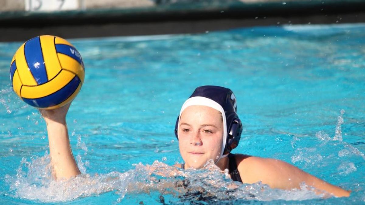 Eminie Rivera looks for a shot during water polo practice at Clovis High School.