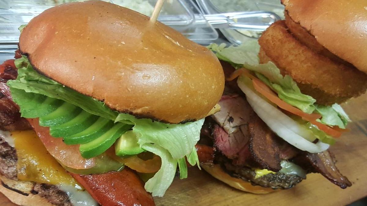 Guests at Uncle Buddy’s Smokehouse N Grill can customize their burgers with a variety of fixings.