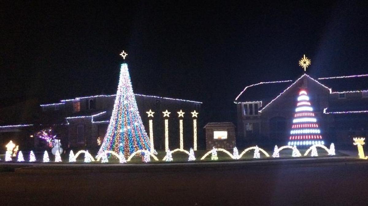About 100,000 lights at the homes on Santa Claus Lane change color, blink and fade out to the tune of 16 Christmas songs played on 98.5 FM.