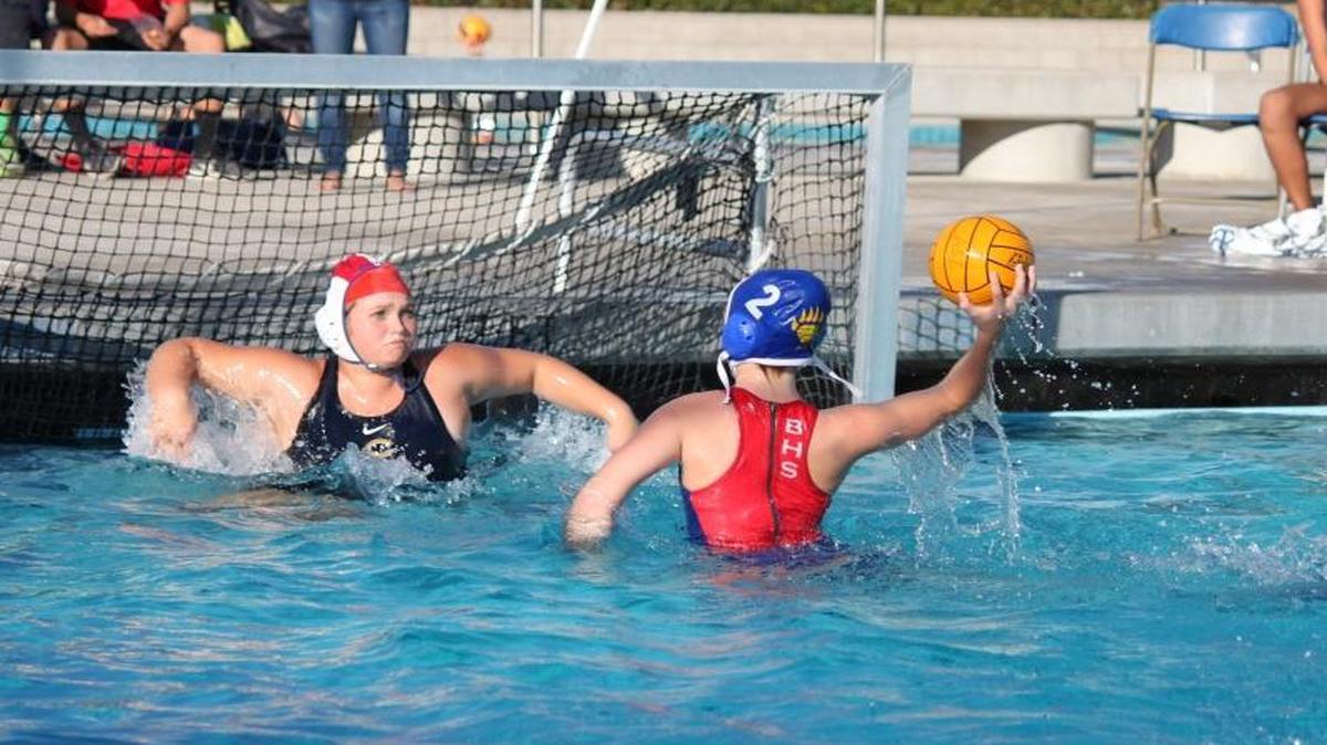 Autumn Berrett, wearing the No. 2 cap, prepares to shoot a goal.