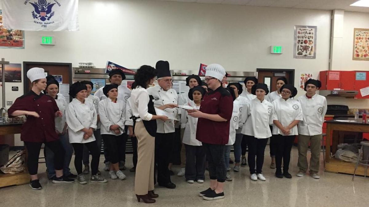 
DeeAnn Walters, executive director at Golden Living Center, presents Clovis East senior Bethany Black with a certificate for preparing the winning entry in the center’s 2015 soup making competition.
