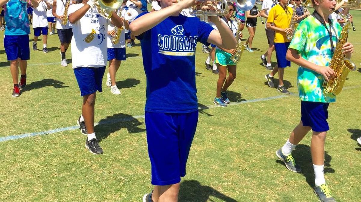 
Gunnar Tapp, front left, and other members of the Clovis High band practice marching.
