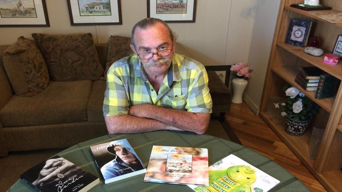 HBE Publishing owner Dan Dunklee displays some of the fictional works that have been published locally. Dunklee and his wife, Peggy, also own A Book Barn in Old Town Clovis.