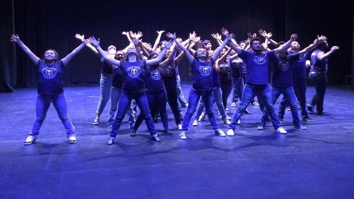 The cast of “A Brand New Day” rehearses the opening dance number.