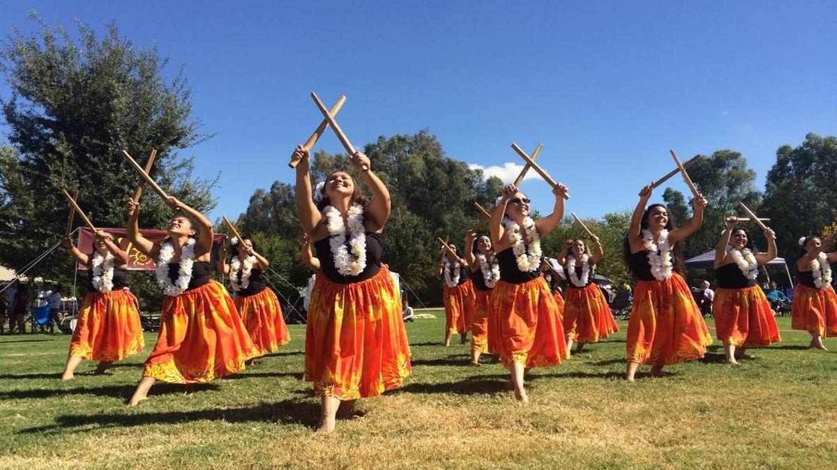 Dancers use split bamboo as part of their performance.