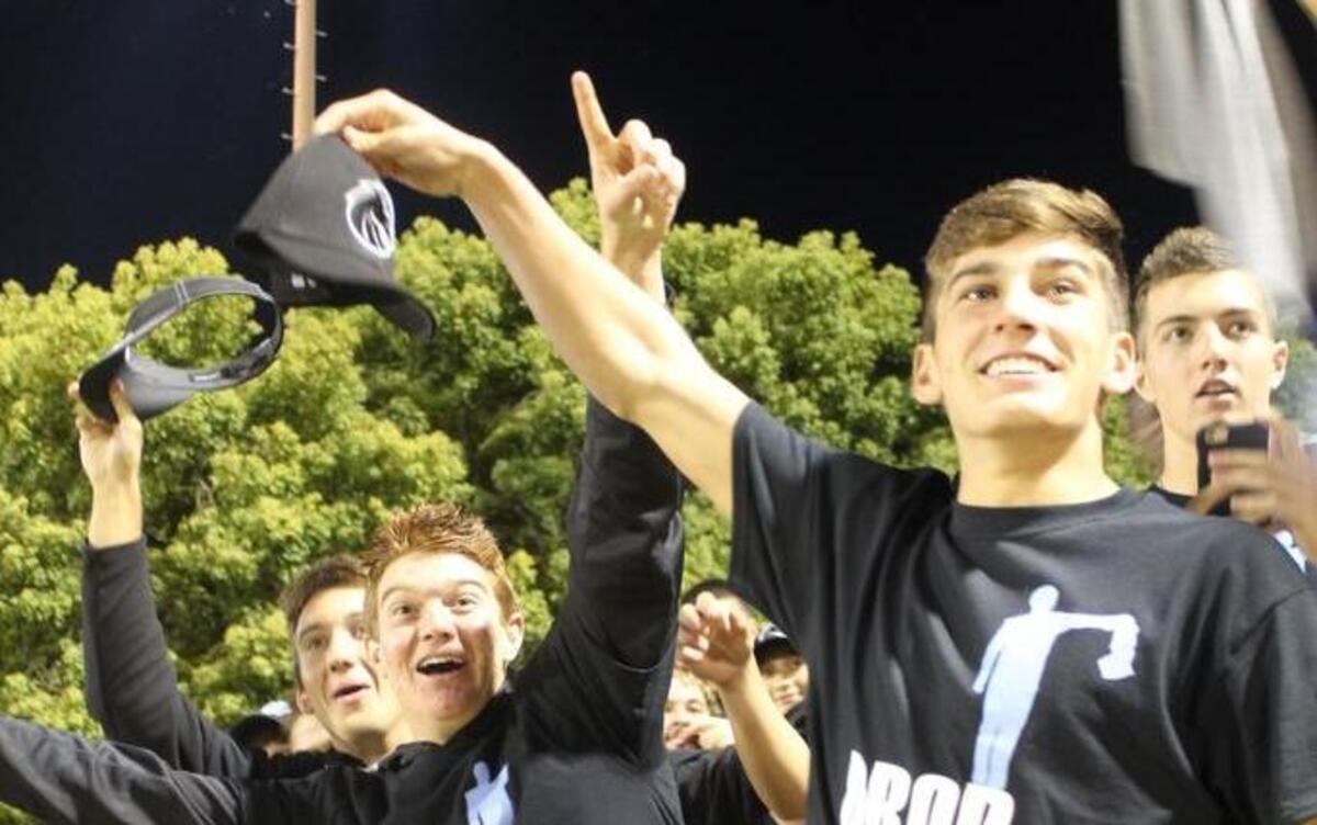Clovis North High School football players stand in anticipation of the Broncos’ marching band beginning its competition field show on Oct. 29 at Lamonica Stadium. Brock Jones, right, prepares to drop his hat, copying a move that the band’s drum major does at the start of every show. To Jones’ left are Nick Caviglia and Chad Fugman. Behind Jones is Jordan Ayerza.