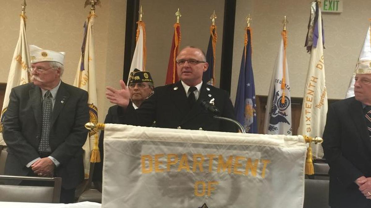 Clovis firefighter Brian Cox accepts the Firefighter of the Year award from the American Legion Department of California.