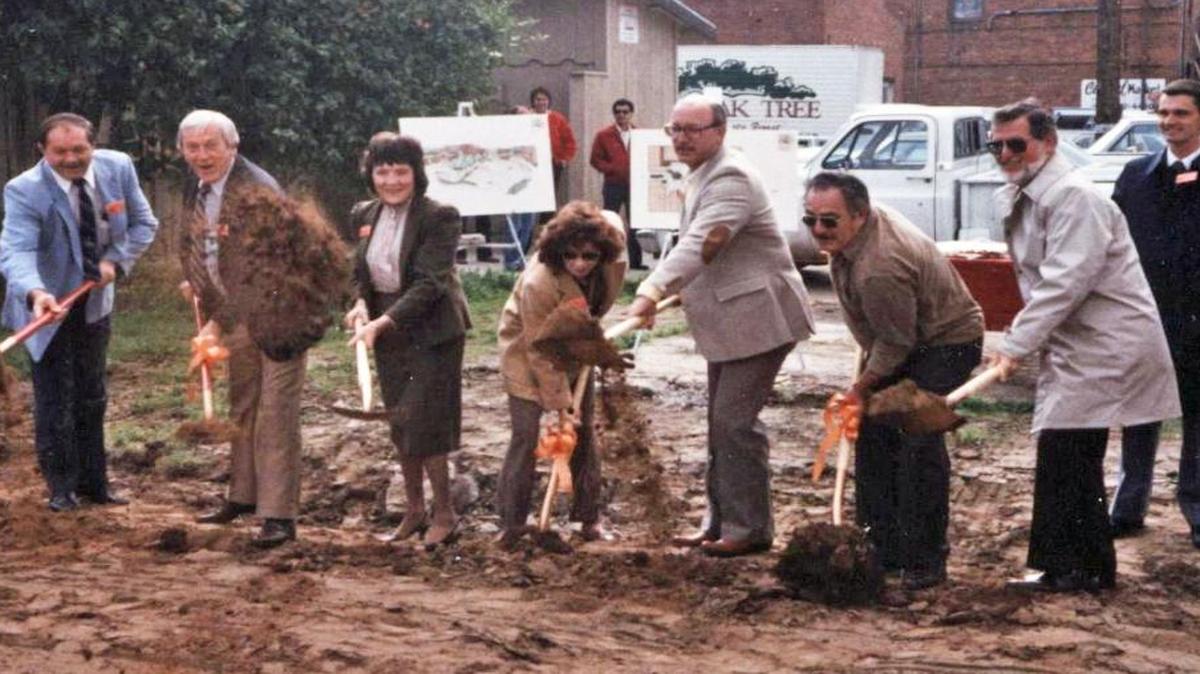 From left to right are Tom Stearns, Harry Armstrong, Peg Bos, Marilyn Zigner,　 Garry Woodward, chamber director Ole Matheison, city manager Alan Goodman and city planning director John Wright at a groundbreaking in Old Town Clovis in 1986.